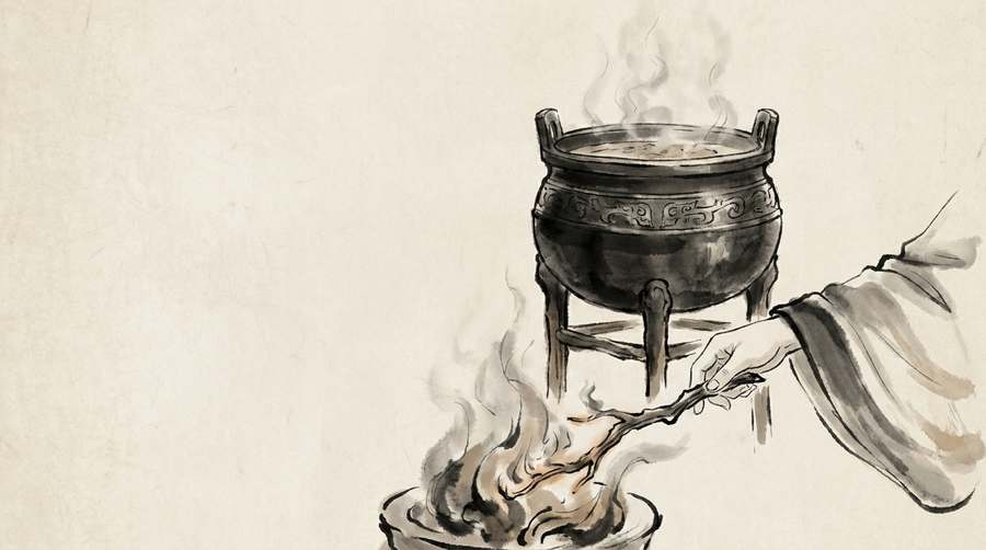 A cauldron still steaming while the last burning stick is drawn from beneath it.