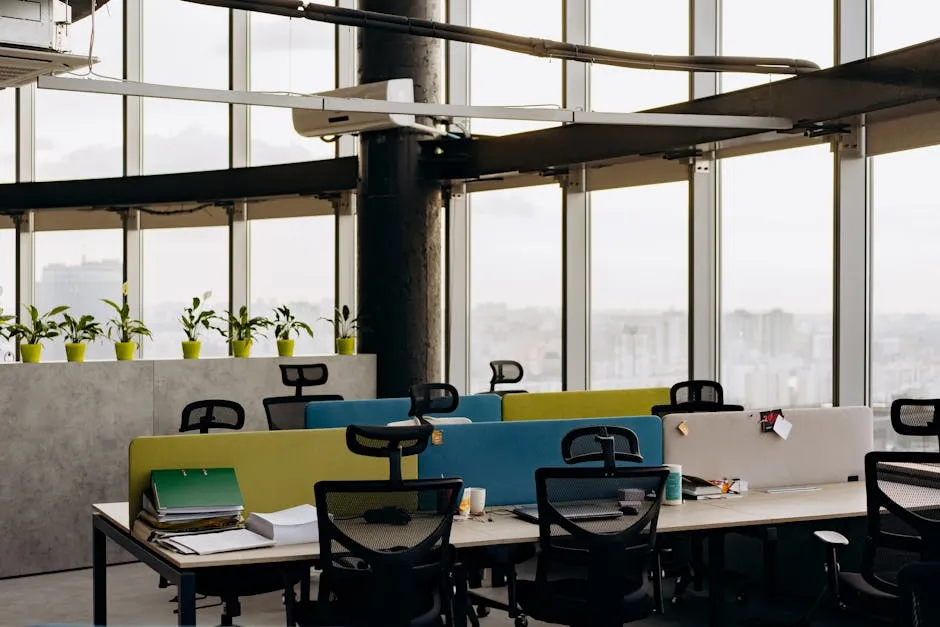Empty office desks at dusk, illustrating the question of AI-driven job displacement.