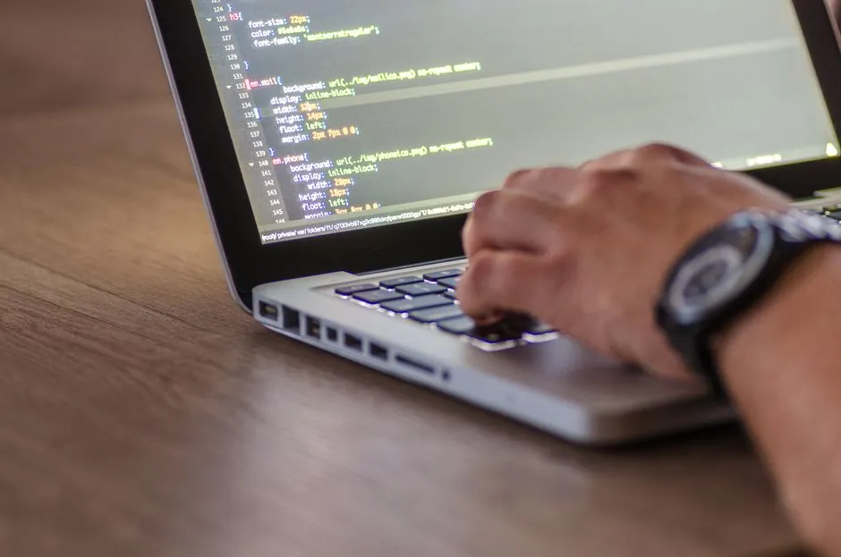 Laptop showing code and a container configuration, illustrating cloud development environments for AI agents.