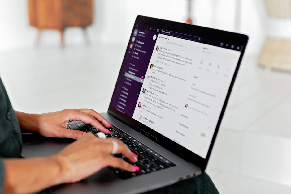 Person messaging on a laptop chat app, illustrating an AI assistant working inside team chat tools.