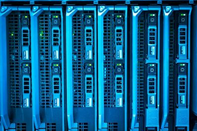 Detailed image of illuminated server racks showcasing modern technology infrastructure.