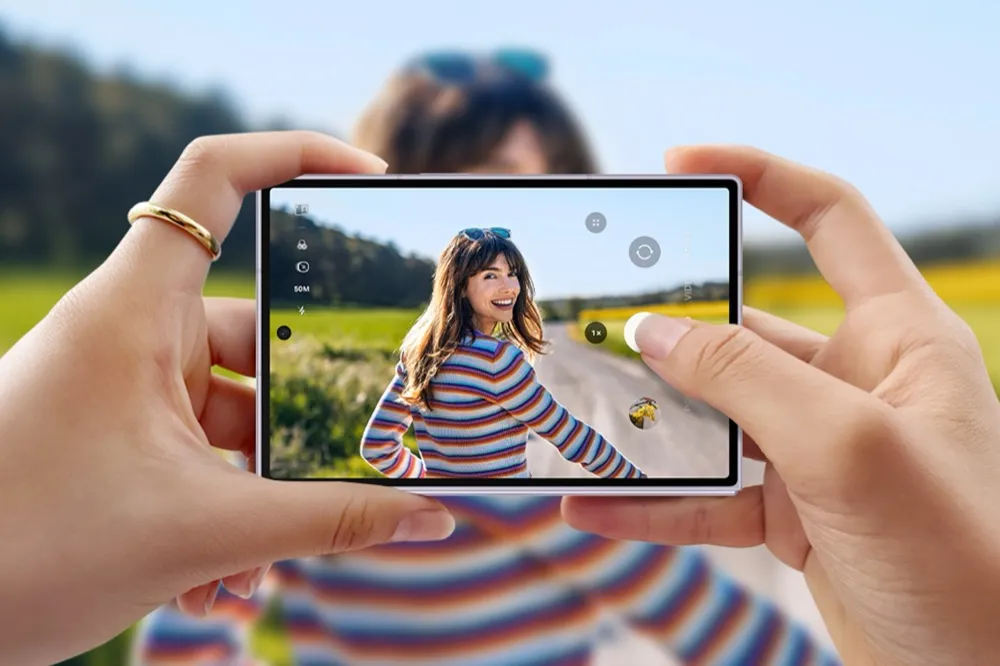 A Galaxy Z Fold8 Ultra held horizontally in two hands, its camera app showing a 50MP capture