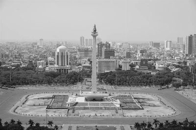 A stunning aerial view of Jakarta's National Monument in monochrome.