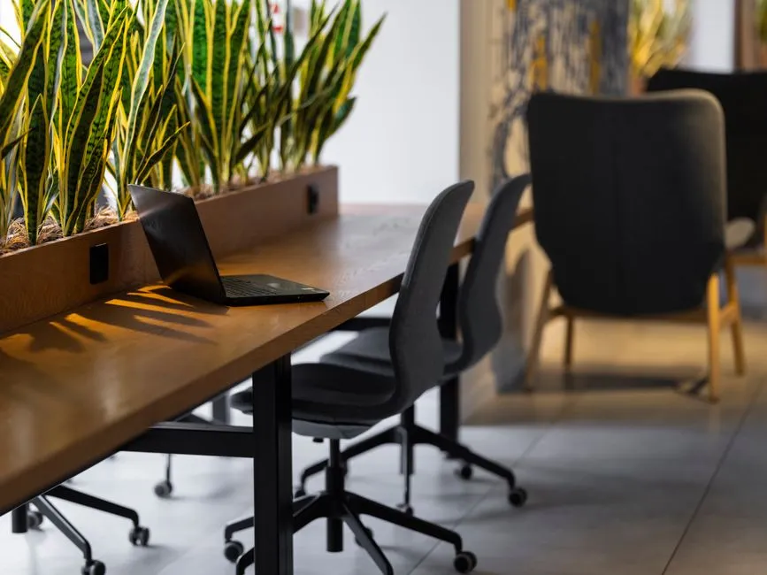 Laptop on an office desk — local LLM apps run entirely on your own machine