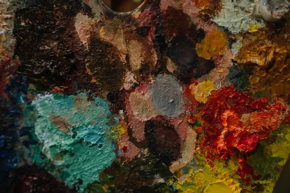 An artist palette thick with mixed paint — five AI image generators, five different licences