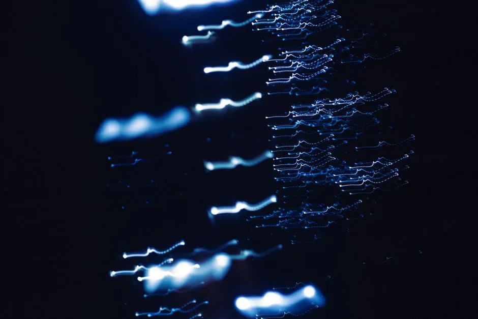 Streaks of blue and white light against a black background, illustrating a report on a rack-scale system claiming much faster token generation per user.