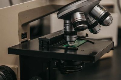 Detailed view of a laboratory microscope, essential for scientific research and analysis.