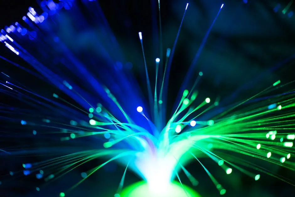 Illuminated fibre optic strands, illustrating a report on Kioxia taking an optical solid-state drive to customer trials.