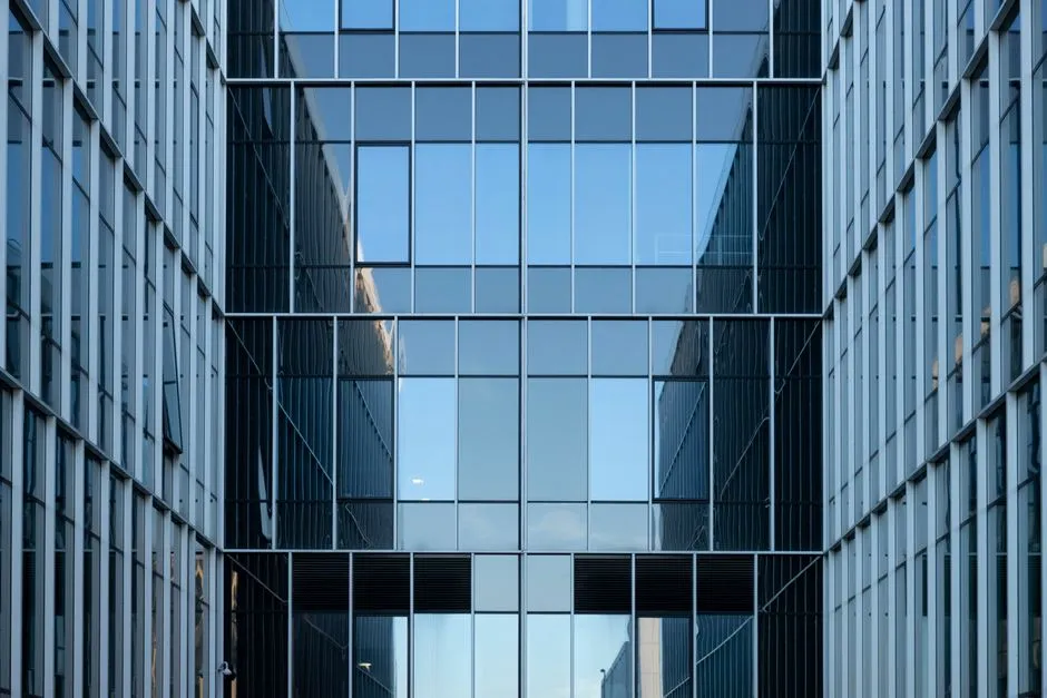 A modern glass office building, illustrating a report on reported private equity takeover talks for the software company Workday.