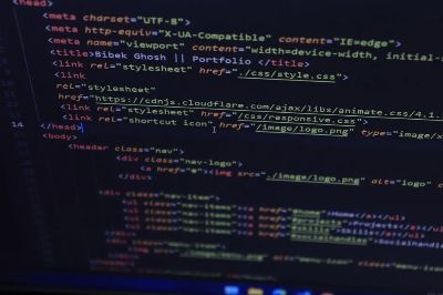 Close-up of HTML and CSS code displayed on a computer screen, ideal for tech and programming themes.