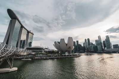 Breathtaking view of Singapore Marina Bay with iconic architecture and skyline during dusk.