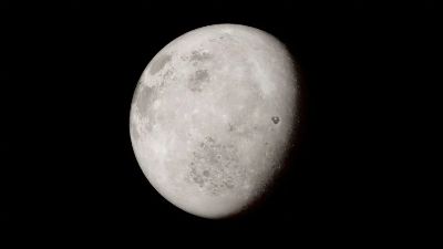 A detailed image of the moon's surface showing its unique craters and textures against a black background.