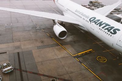 Qantas commercial airplane parked on the tarmac at Melbourne Airport, Australia.