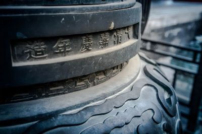 Detailed view of historic Chinese stone with intricate carvings and characters.