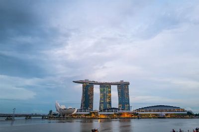 Capture of Marina Bay Sands in Singapore at dusk with scenic sky and waterscape.