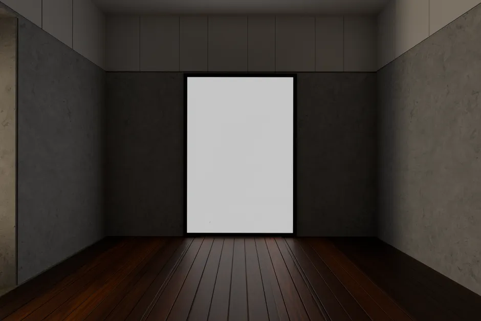 An empty frame hanging on the wall of a dark gallery room