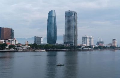 Stunning view of Da Nang skyline with Han River reflecting modern architecture, Vietnam.