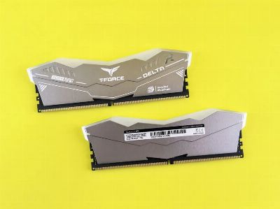 T-Force Delta RGB DDR5 memory modules on vibrant yellow surface.