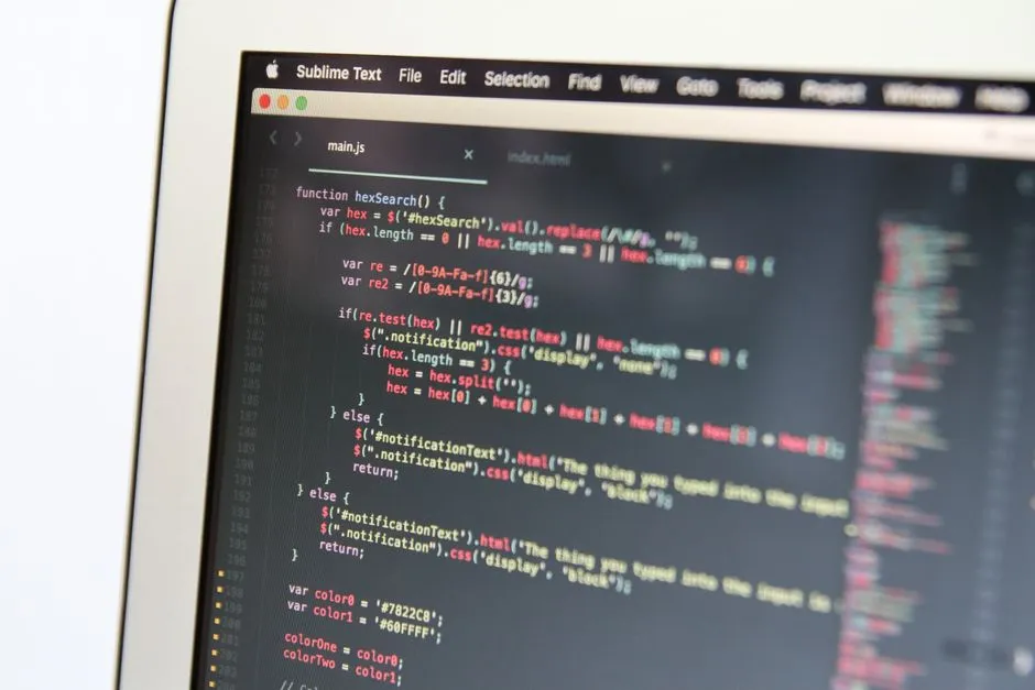 JavaScript code in an editor on a laptop screen
