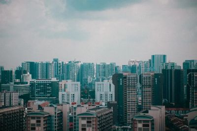 A stunning cityscape view of Singapore's high-rise buildings under a cloudy sky, showcasing urban architecture.
