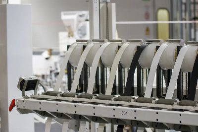 Modern industrial machine in operation in a manufacturing facility showcasing advanced technology.