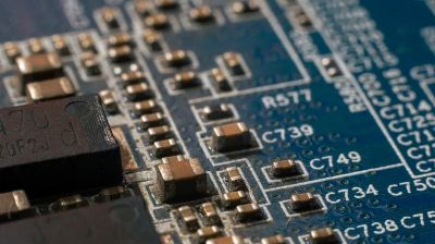 Detailed macro shot of a circuit board highlighting electronic components and traces.