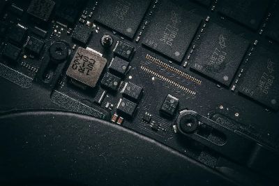 Detailed macro shot of electronic circuit board showing microchips and components.