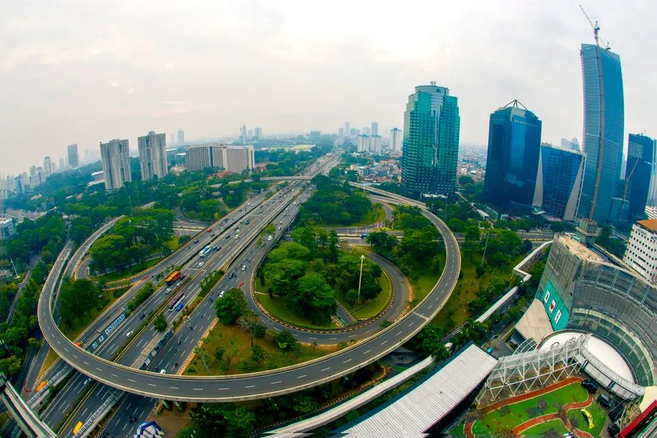 Jakarta's skyline above the Semanggi interchange; Princeton Digital Group's hyperscale campuses are being built east of the capital