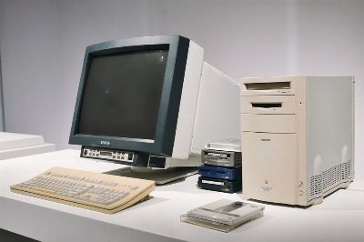 A retro computer setup featuring a classic CRT monitor and vintage CPU, showcasing technology history.