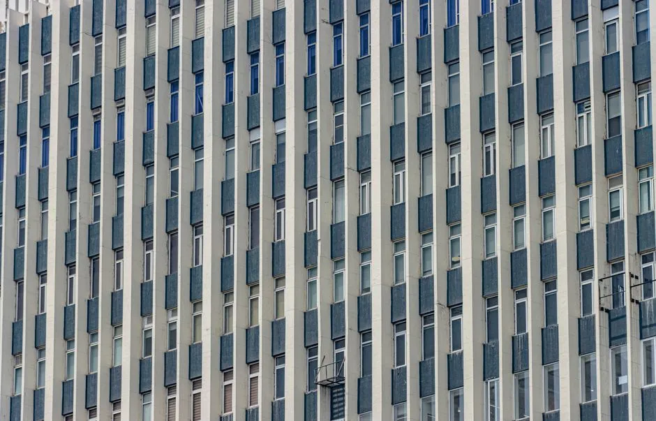 Close-up of a modern building facade with vertical symmetry in New Delhi, showcasing architectural aesthetics.