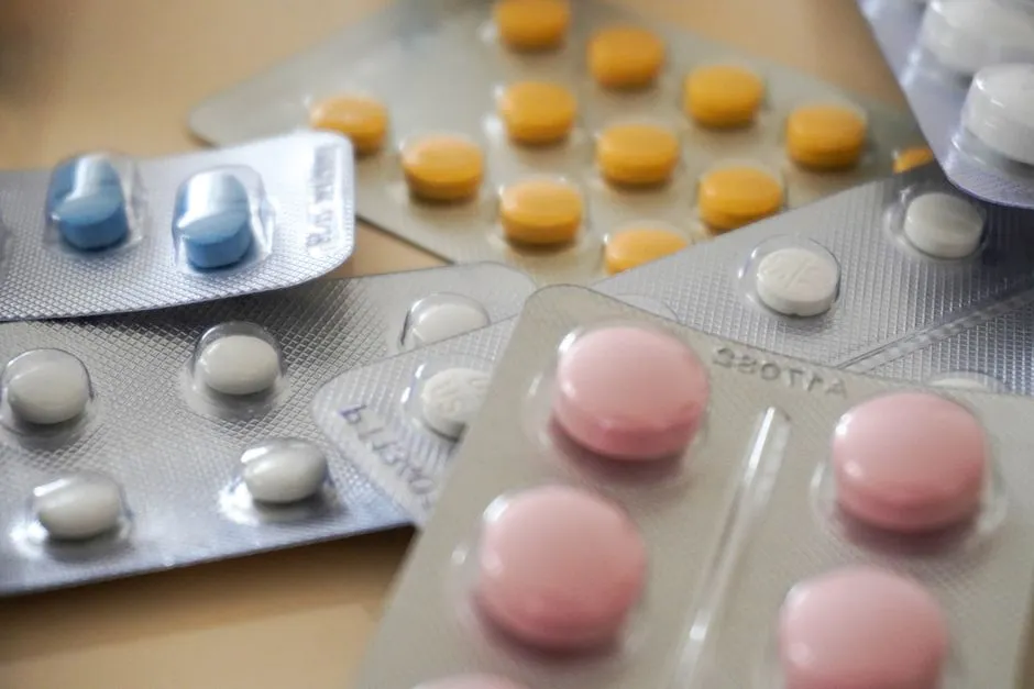 Tablets of different colours in blister packs