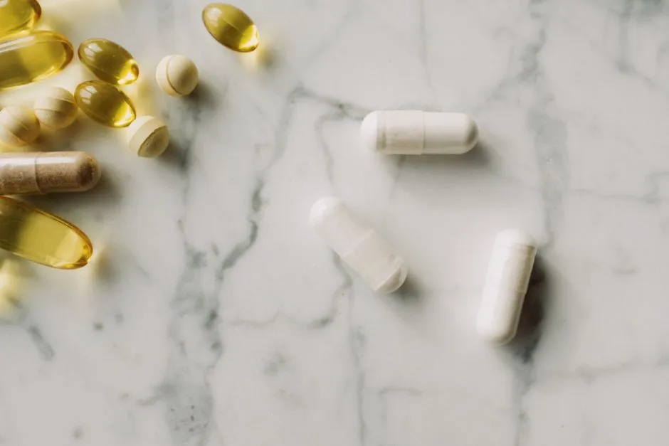 Supplement capsules scattered on a marble surface