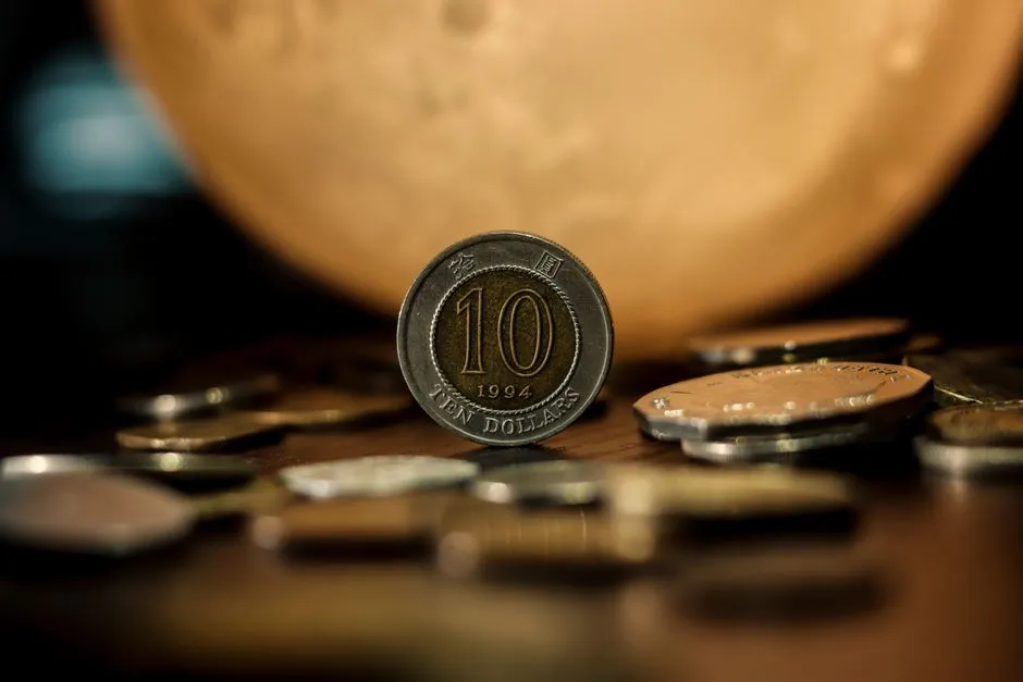 Close-up of various cryptocurrency coins including Bitcoin, EOS, and Litecoin on a colorful background.