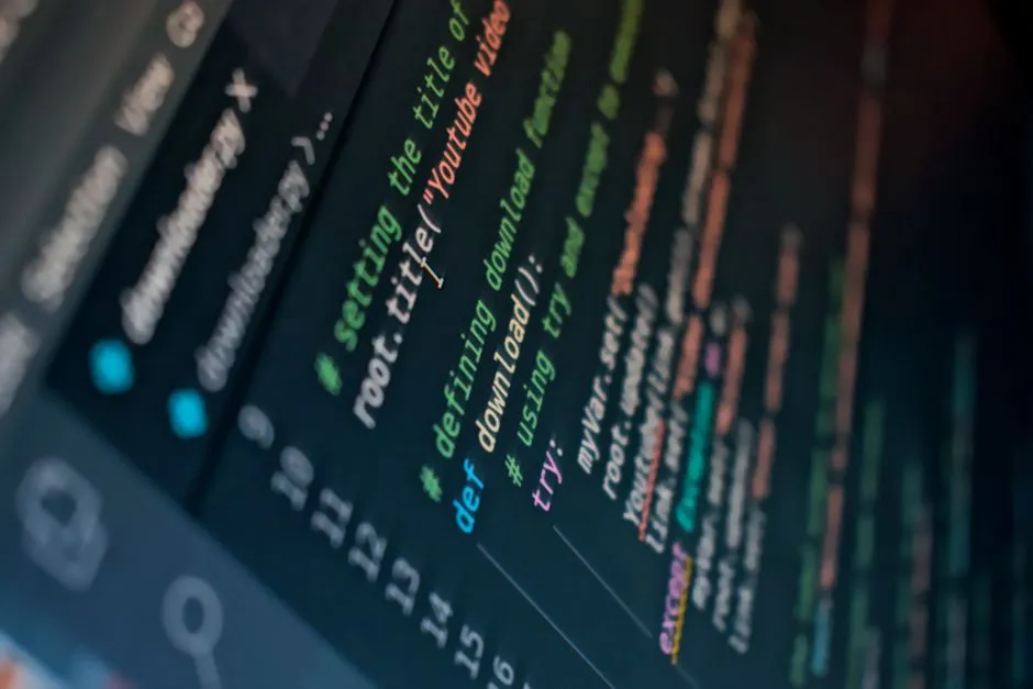 A close-up of a dark code editor at an angle, syntax-highlighted Python filling the screen with a download function part-way down.