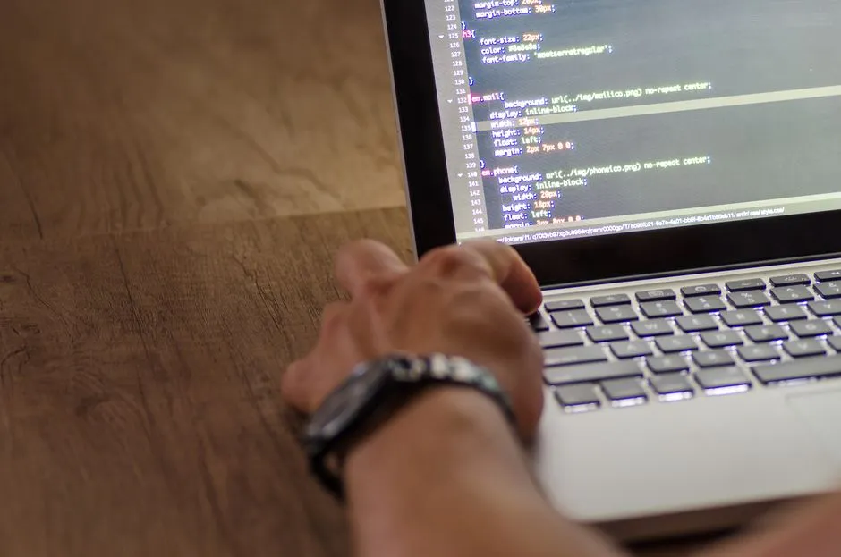 A developer working in a code editor, the surface whose model access is being withdrawn