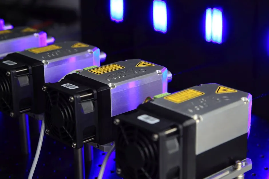 Laser equipment on an optical bench, illustrating a report on quantum computing company IonQ and what its revenue actually measures.