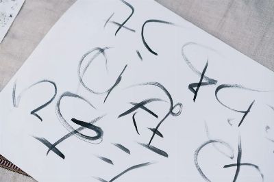 A close-up of elegant Japanese calligraphy inked on white paper, conveying artistic expression.