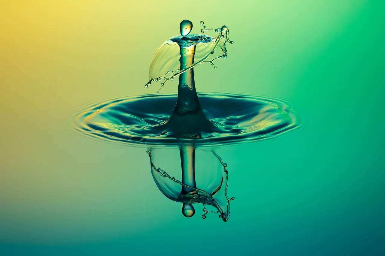 A water drop striking a surface and sending out concentric ripples