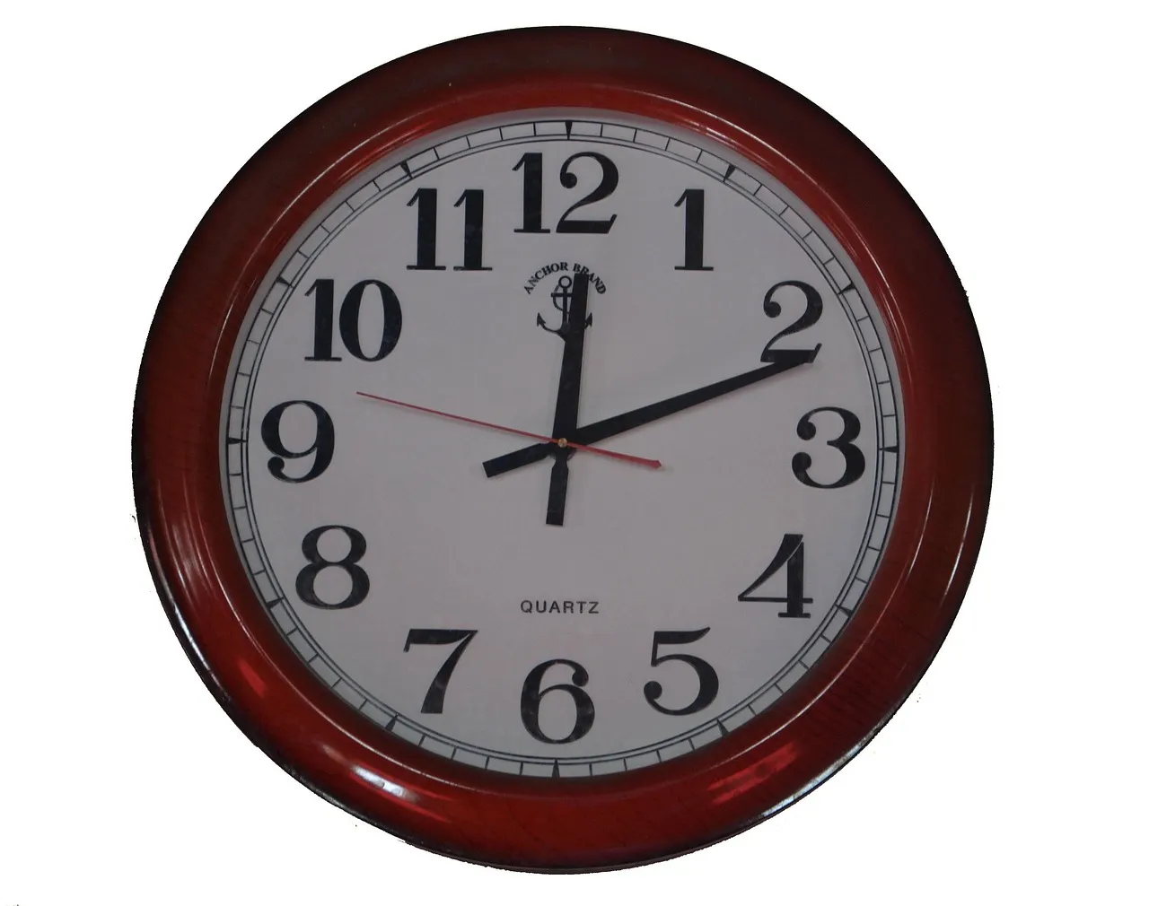 A round wall clock with a dark red wooden rim and black numerals against a plain white background