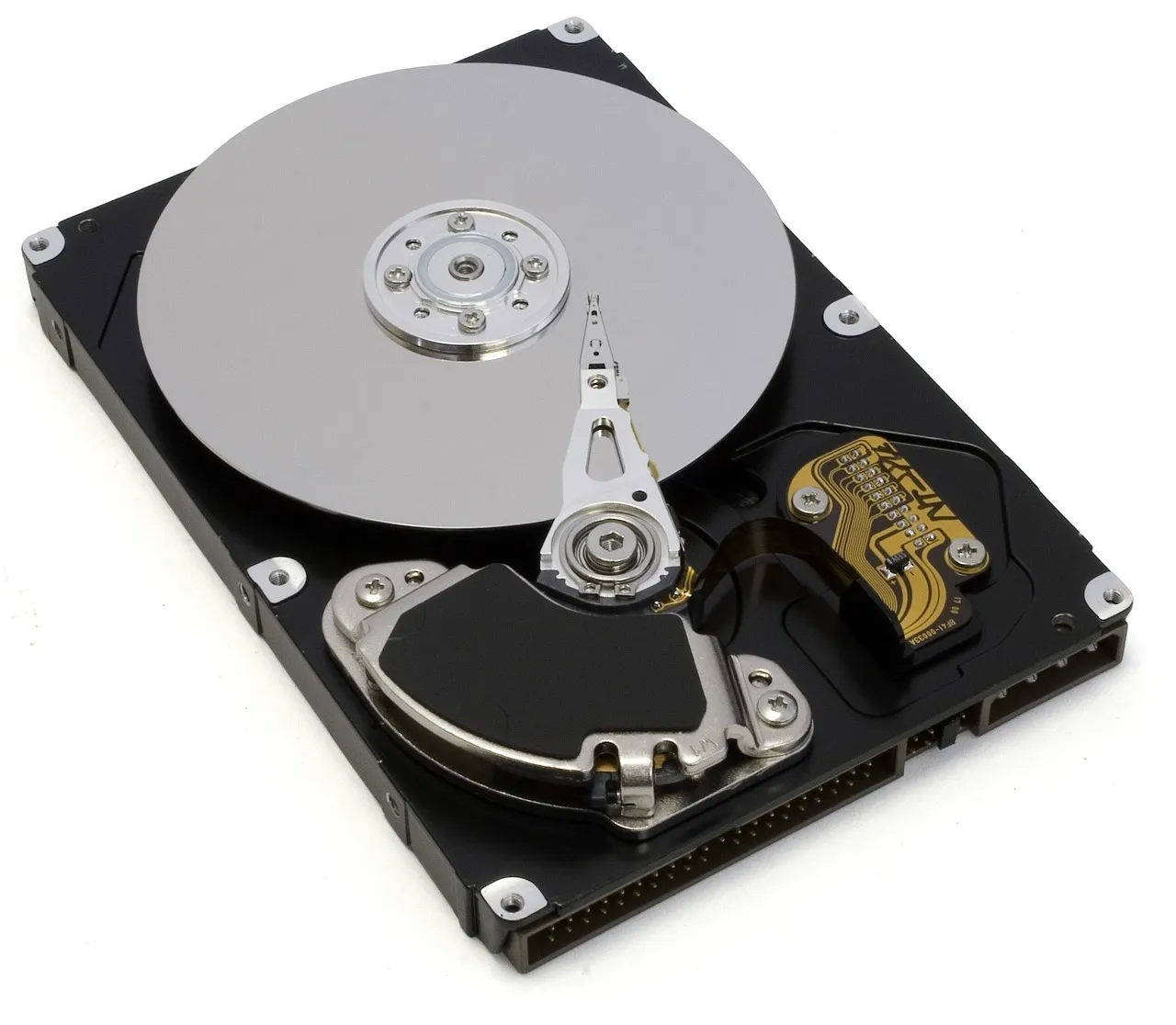 An opened hard disk drive showing its platter and read head