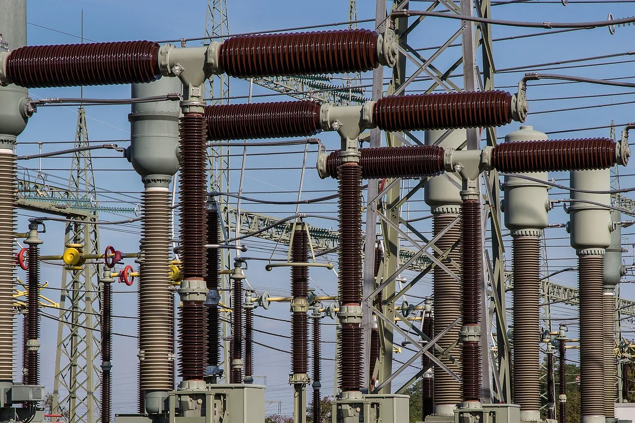 High-voltage insulators and switchgear at an electrical substation, illustrating a report on Singapore updating its cybersecurity code of practice for critical information infrastructure.