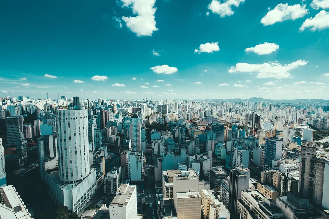The Sao Paulo skyline seen from above under a partly clouded sky