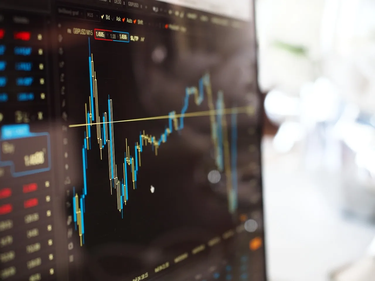 A candlestick price chart on a trading screen, representing the quarter in which Nvidia paused its cloud financing programme