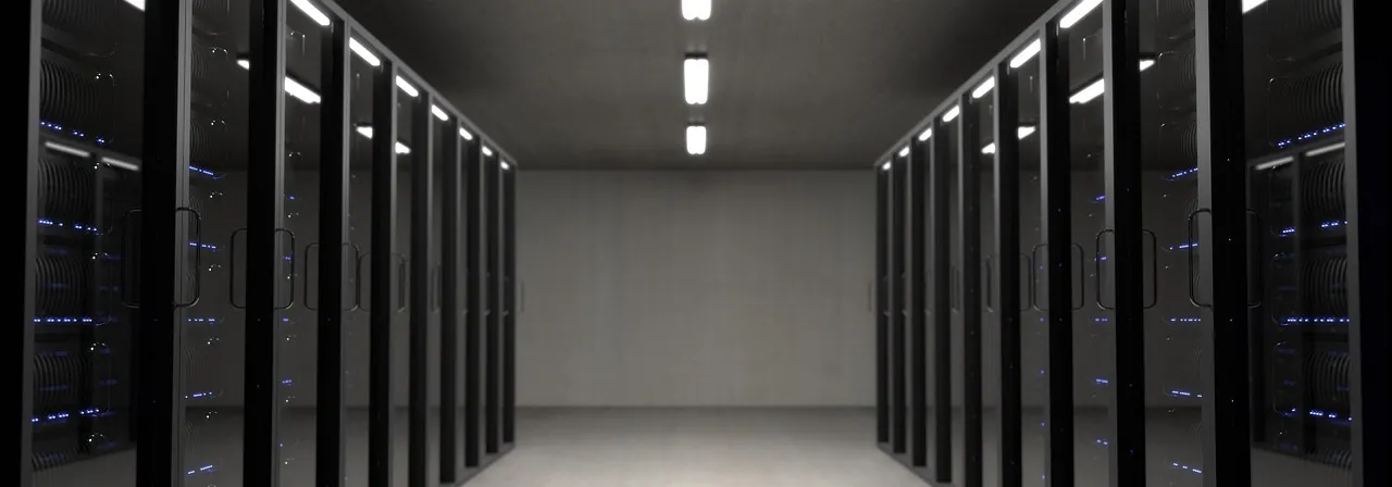 A corridor of server racks in a data centre