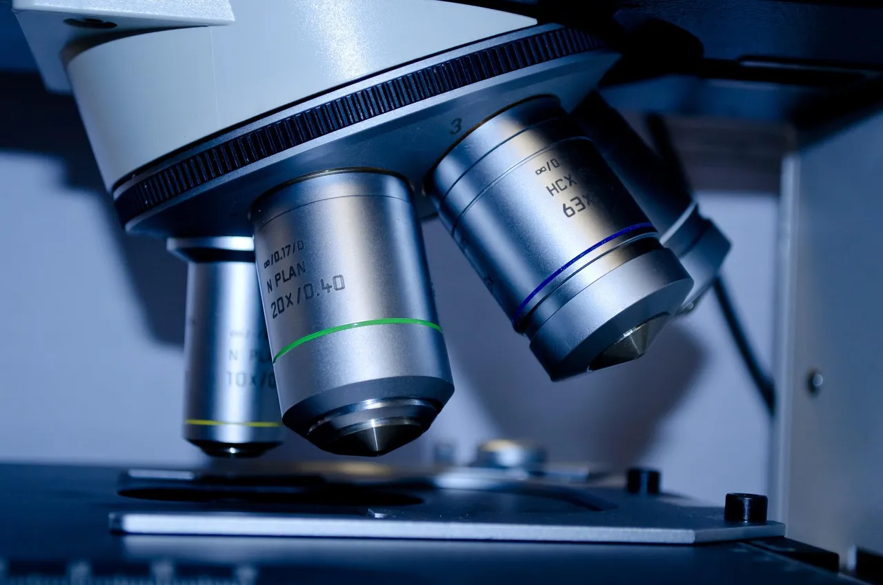 Close-up of the objective lenses on a laboratory microscope