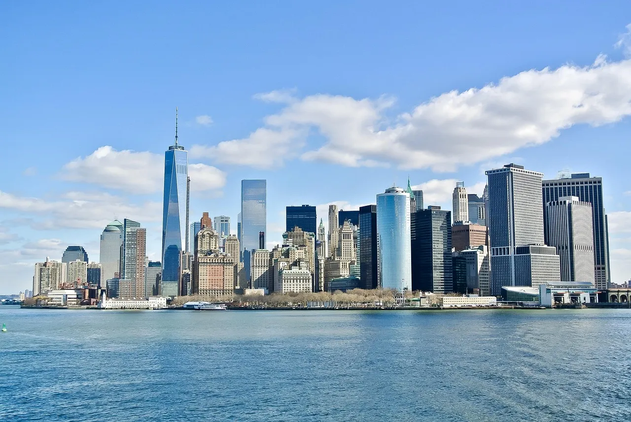 Illustrative: the Lower Manhattan skyline seen across the water on a clear day.