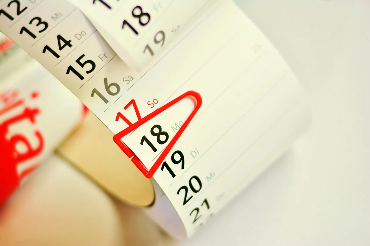 A tear-off wall calendar with one date circled in red