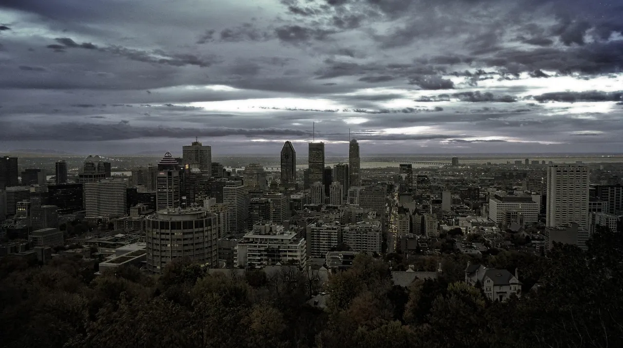 The Montreal skyline at dusk seen across the water