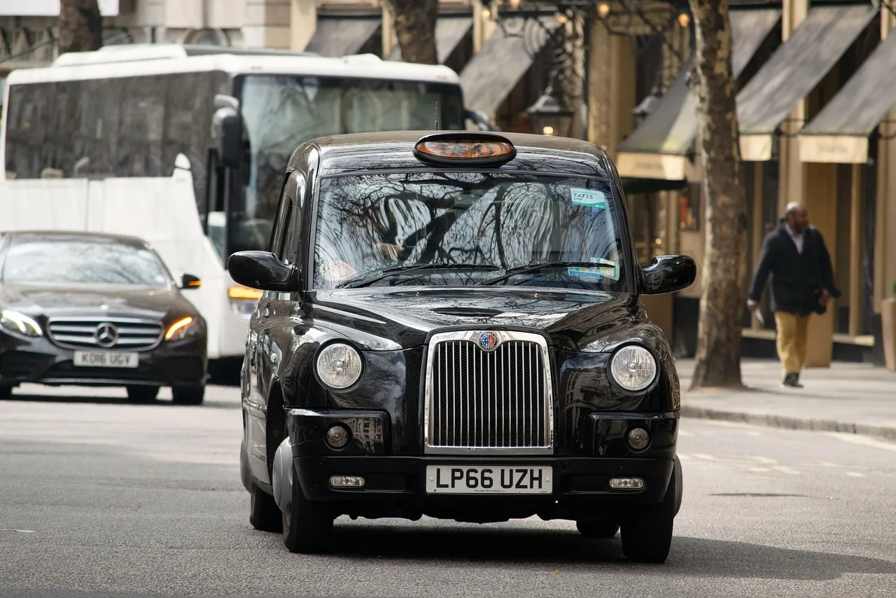 A black cab on a London street, the incumbent service robotaxi operators are waiting for permission to compete with