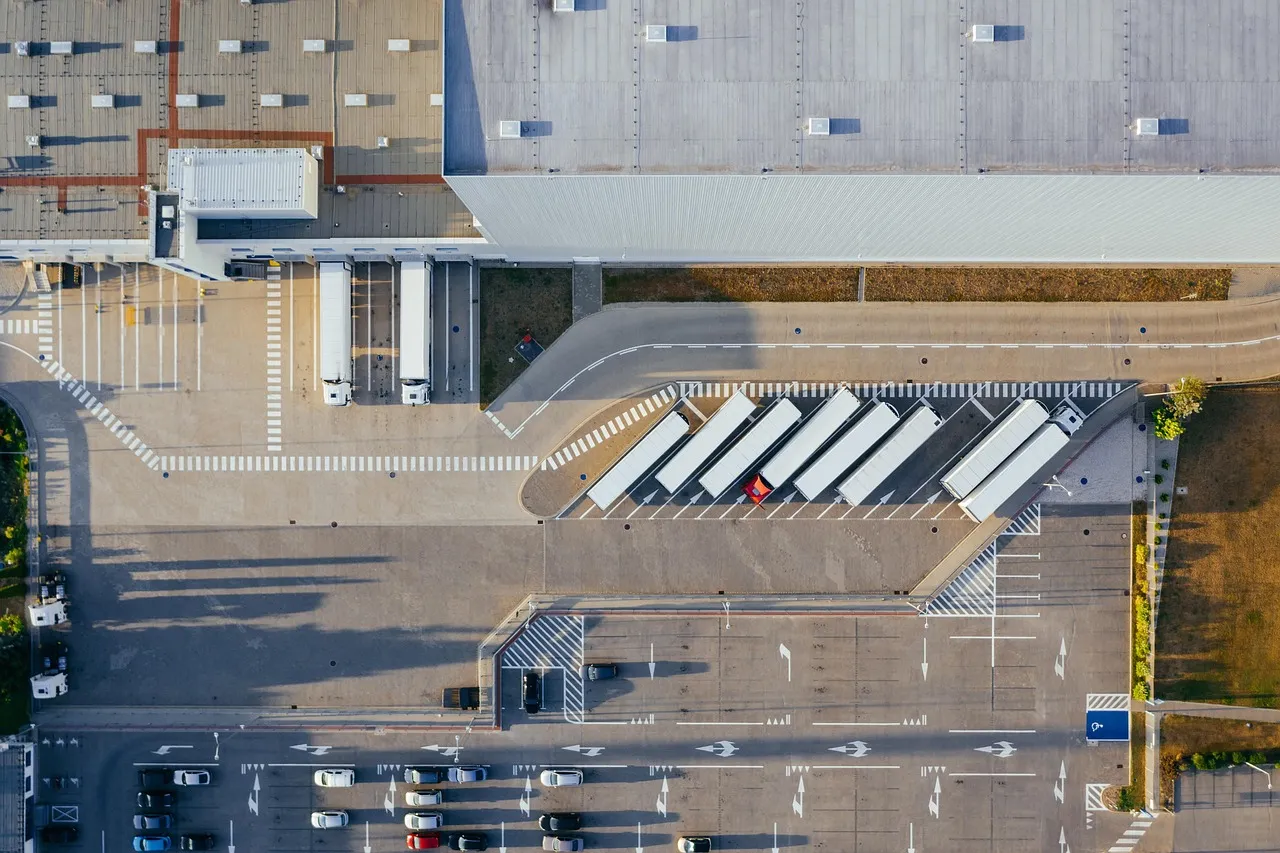 An aerial view of an industrial facility with loading bays, the park model the two countries built over thirty years